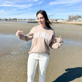 Taupe Tan crewneck sweatshirt, New England text on the front of the sweatshirt, relaxed fit, anchored american logo on the back of the sweatshirt