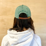 Green baseball cap with green 860 embroidered on the front, and a green anchored American embroidered on the back.