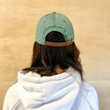 Green baseball cap with green 860 embroidered on the front, and a green anchored American embroidered on the back.