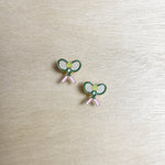 pickleball racket, tennis ball, pink handle. stud earring