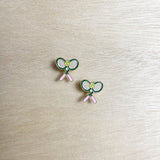 pickleball racket, tennis ball, pink handle. stud earring