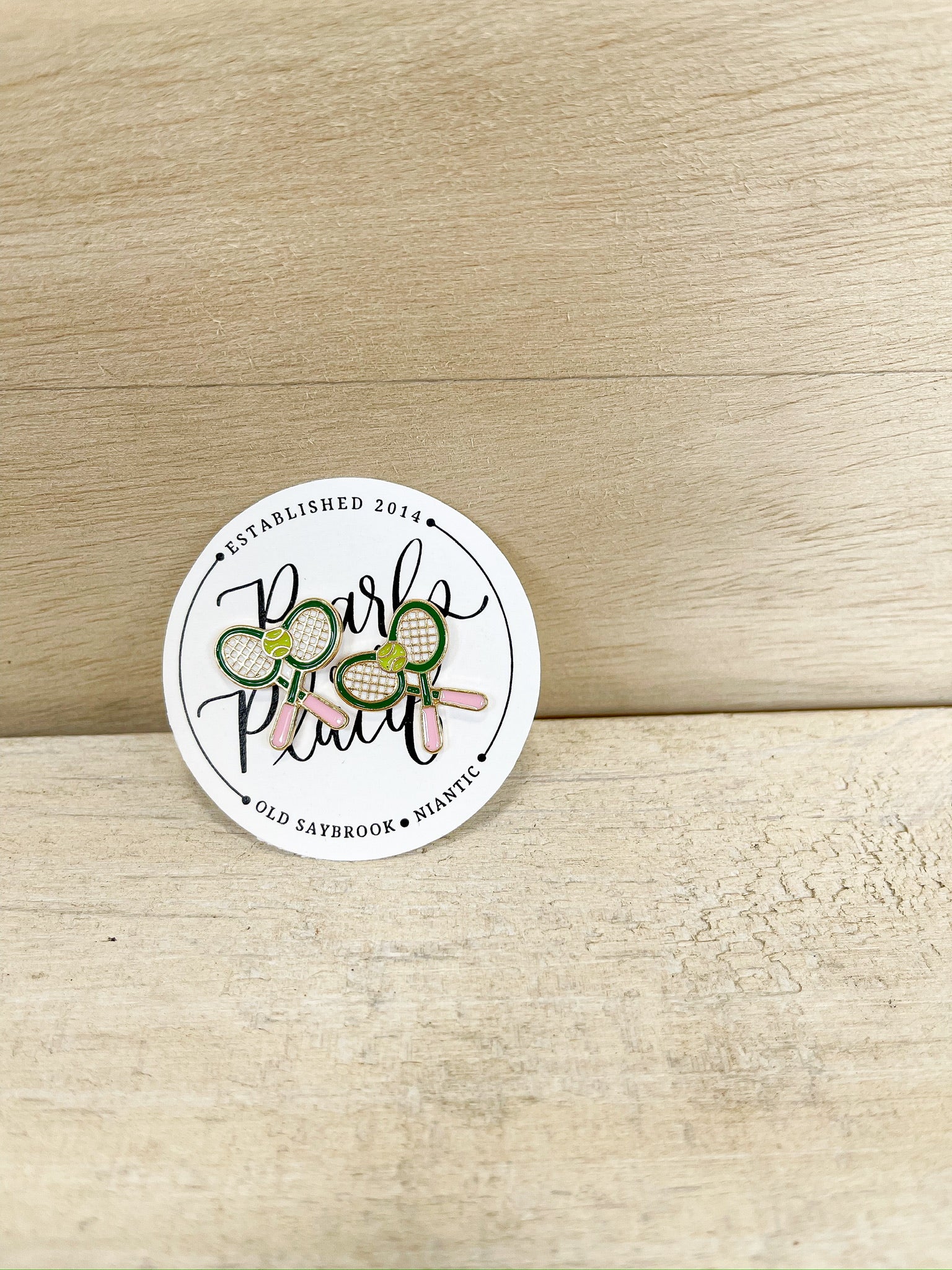 pickleball racket, tennis ball, pink handle. stud earring