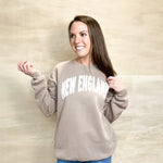 Taupe Tan crewneck sweatshirt, New England text on the front of the sweatshirt, relaxed fit