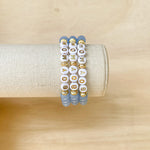 Handmade bracelet, locally made, blue beads, gold lettered beads that say boy mom, gold beads separate the words 