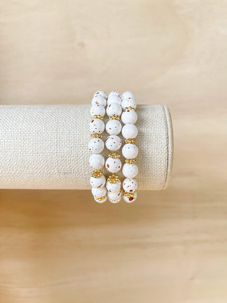 Handmade bracelet, locally made, soft clay bead, stretch bracelet, gold and white speckled beads separated with gold spacers