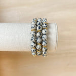 Handmade bracelet, locally made, soft clay bead, stretch bracelet, black and grey speckled beads separated with gold spacers