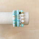 Handmade bracelet, locally made, soft clay bead, stretch bracelet, teal, white beads, paired with some other Callie favorite bracelets