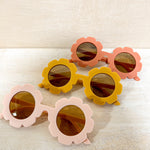 Kids floral sunglasses in pink, yellow, and red