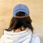 Blue baseball cap with blue 860 embroidered on the front, blue anchored american embroidered on the back leather adjustment strap