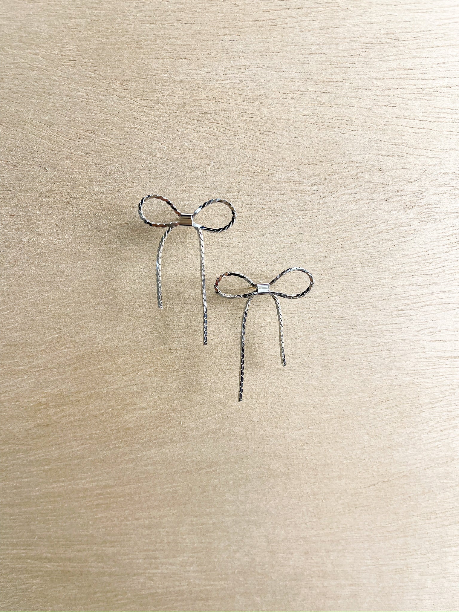silver long bow, delicate, thin bow, stud 
