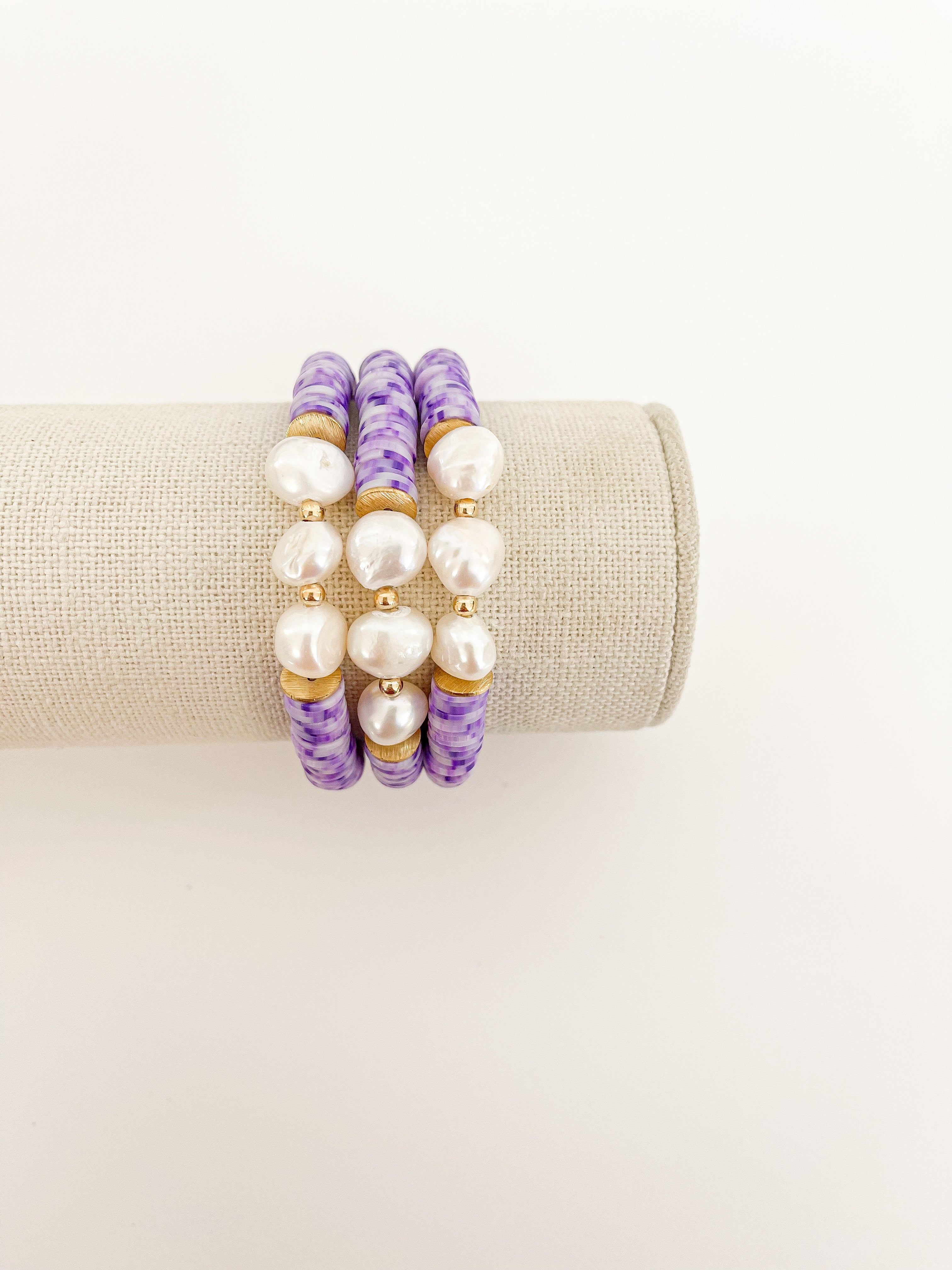 Handmade bracelet, locally made, soft clay bead, stretch bracelet, light and dark purple speckled beads with three pearls and gold beads in between